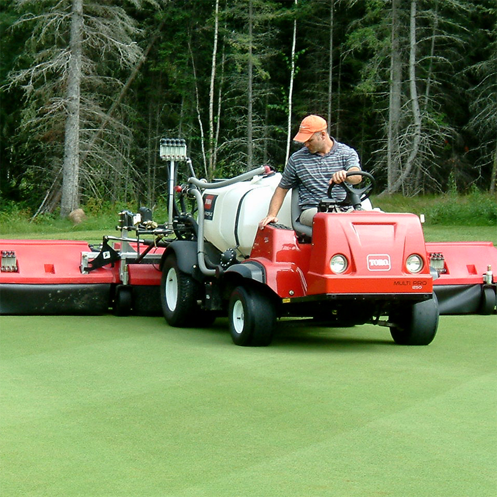 A golf course sprayer with shroud, using Flow Indicators to identify any plugged nozzles.